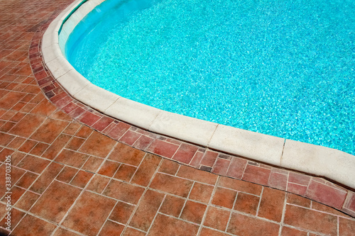 A Step in the pool by the sea nature background. For bathing turquoise water.