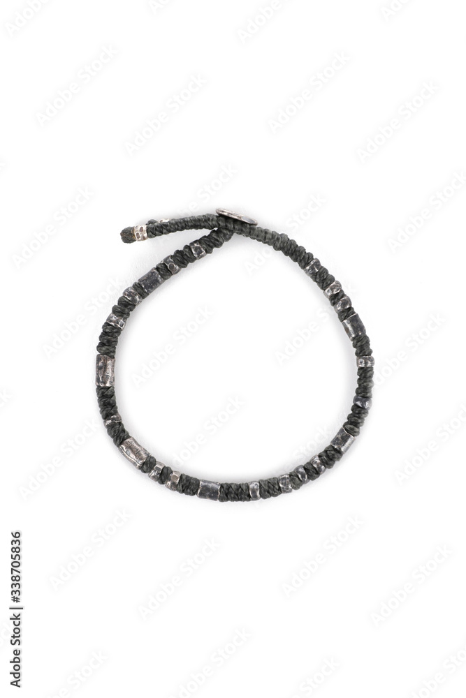 Black bracelet on the arm, view from above Black bracelet on the arm, view from above
