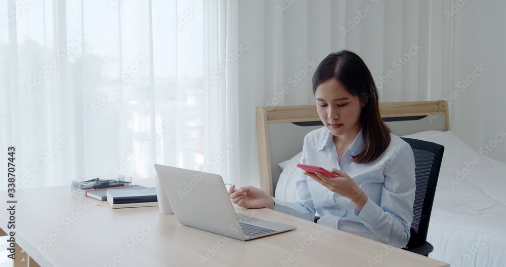 Portrait young beautiful woman use laptop and smartphone Portrait young beautiful woman use laptop and smartphone