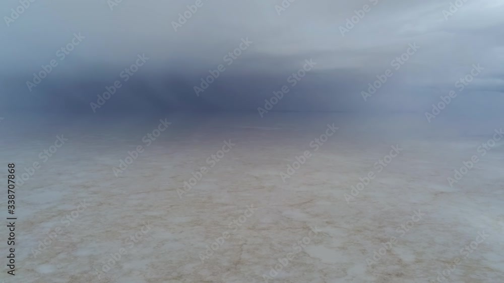 Mysterous Scenery of Salt Flat and Mist Above. Salar de Uyuni, Bolivia and Endless Gloomy Horizon Mysterous Scenery of Salt Flat and Mist Above. Salar de Uyuni, Bolivia and Endless Gloomy Horizon