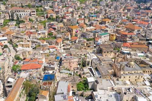 Aerial image of the over the old city houses of Nazareth during Corona Virus lockdown, with no people of traffic in the streets. 