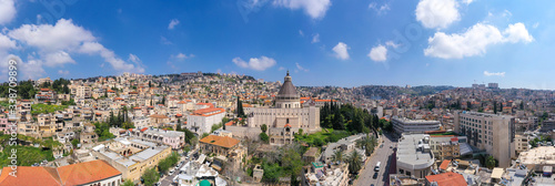 Aerial panoramic image of the Basilica of the Annunciation over the old city houses of Nazareth