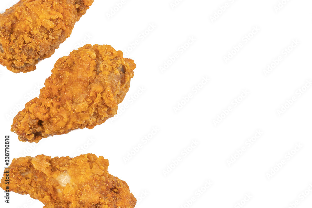 Hot and crispy fried chicken isolated on a white background.junk food and unhealthy food eating concept Hot and crispy fried chicken isolated on a white background.junk food and unhealthy food eating concept