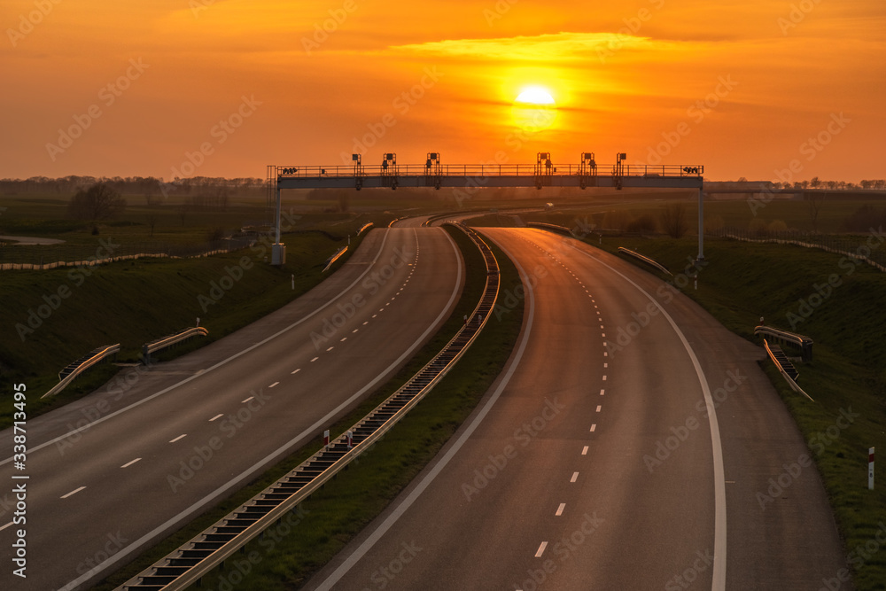 setting sun over an empty highway