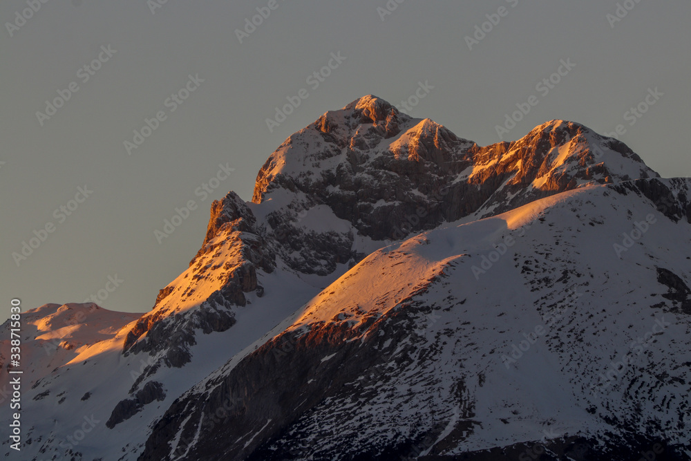 Triglav mountain covered in morning sunrise