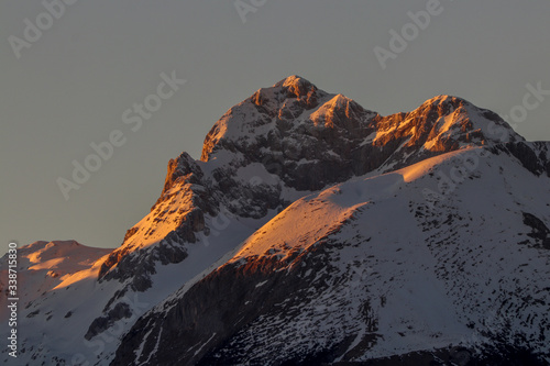 Triglav mountain covered in morning sunrise