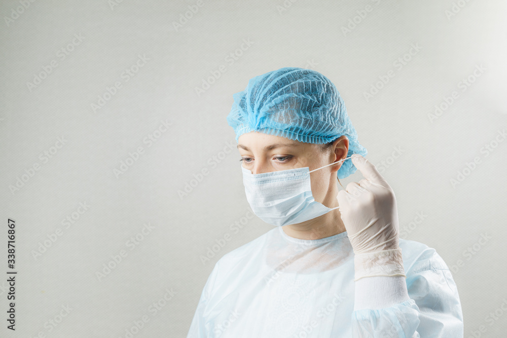 Doctor with protective clothing and face mask in clinic at Covid-19 coronavirus epidemic Doctor with protective clothing and face mask in clinic at Covid-19 coronavirus epidemic