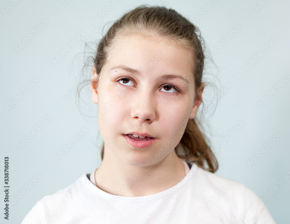 Arrogant facial expression, pre-teen Caucasian girl rolled her eyes, background, emotions series Arrogant facial expression, pre-teen Caucasian girl rolled her eyes, background, emotions series