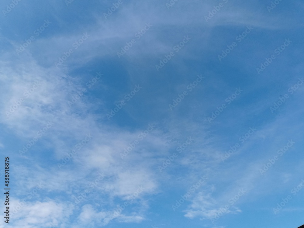 Fototapeta premium Blue sky background with white clouds