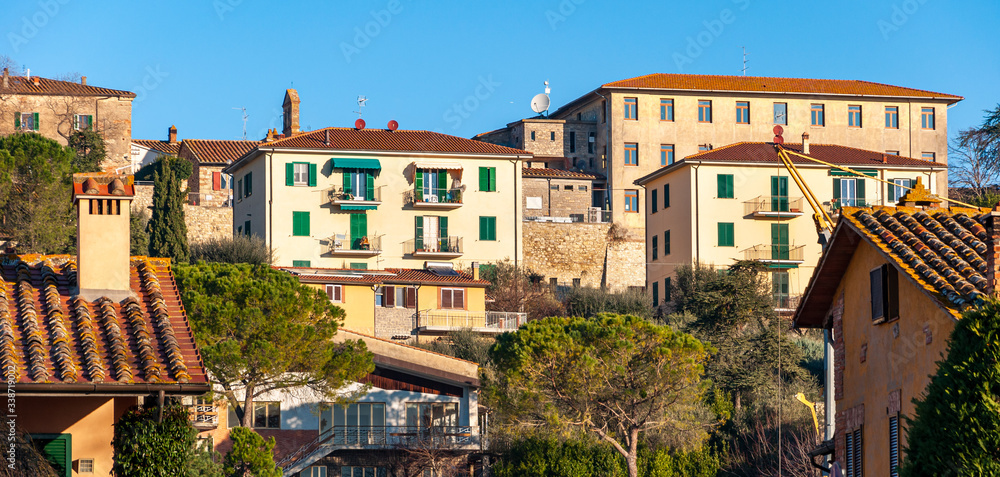 Castiglione del Lago, Umbria, Italy. Medieval village that rises on a promontory on Lake Trasimeno. View of the modern part of the city from the lake shore.