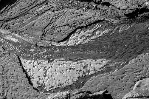 Black and white waterfall stream surrounded with rocks canyon bird eye view shot