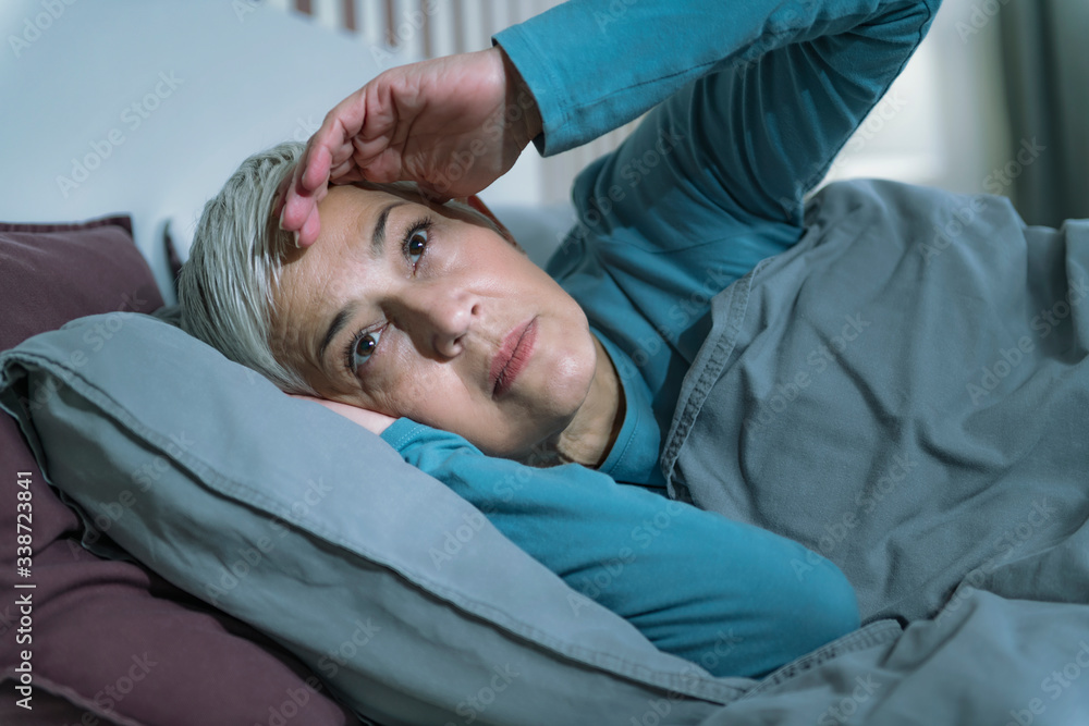 Sleep Disorder. Worried Senior Woman Suffering from Insomnia, Having Headache, Touching her Forehead Sleep Disorder. Worried Senior Woman Suffering from Insomnia, Having Headache, Touching her Forehead