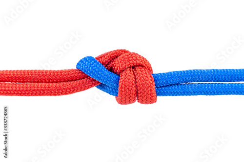 Knot on a cord isolated on a white background .