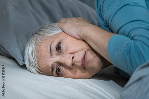 Sleeping Problems.  Mature Woman Suffering From Hyperacusis or Misophonia photo