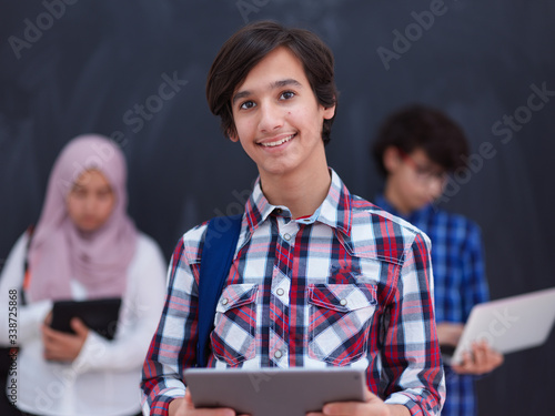 Photography Arab teenagers group working on laptop and tablet computer
