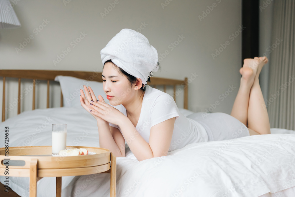 Young asian girls drink milk in bed Young asian girls drink milk in bed