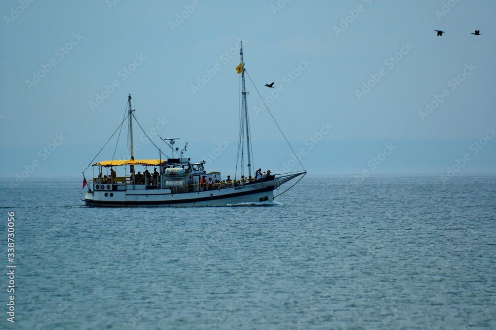 cruise ship on a background of blue sea and cloudless sky