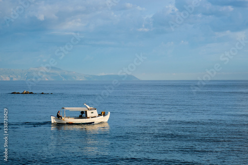 Fishing boat going to sea. Chania, Crete island, Greece © Dmitry Rukhlenko