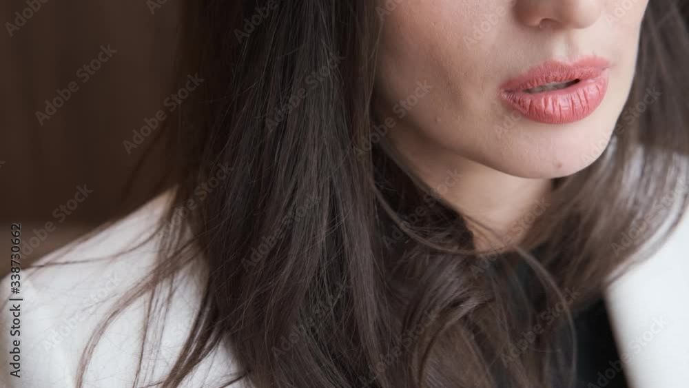 young beautiful girl talking, close-up shot of painted lips.caucasian,4k young beautiful girl talking, close-up shot of painted lips.caucasian,4k