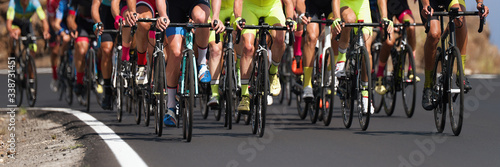 Cycling competition,cyclist athletes riding a race, the peloton climbing the mountain