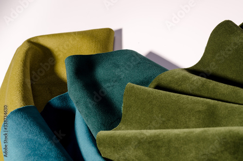 Bright collection of colorful velour textile samples. Fabric texture background