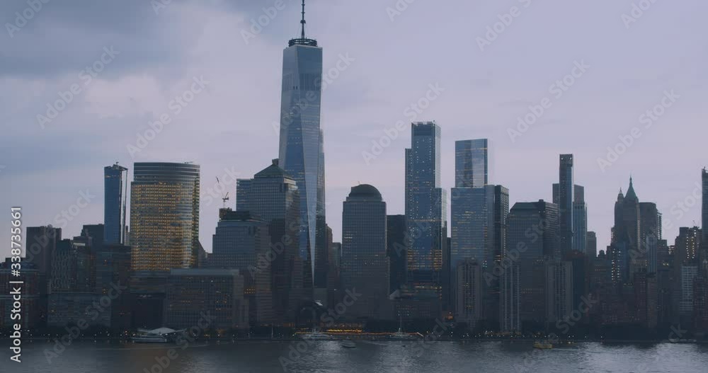 Downtown Manhattan skyline with Freedom Tower against looming thunderstorm sky. Downtown Manhattan skyline with Freedom Tower against looming thunderstorm sky.