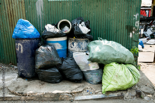 The plastic trash on the side of the road is full of garbage and garbage.