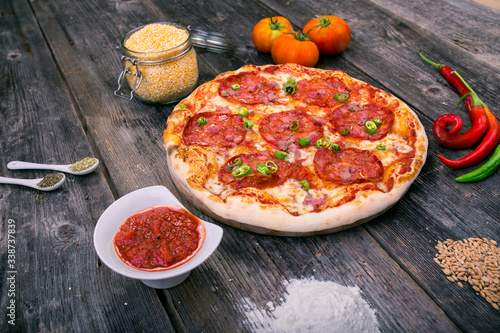Styled Top View of Large Pepperoni Salami Pizza, Food Photography on wooden background table