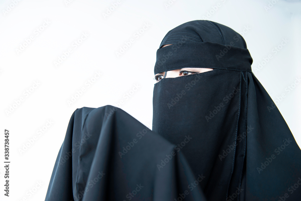 Woman wearing black traditional muslim clothing Woman wearing black traditional muslim clothing