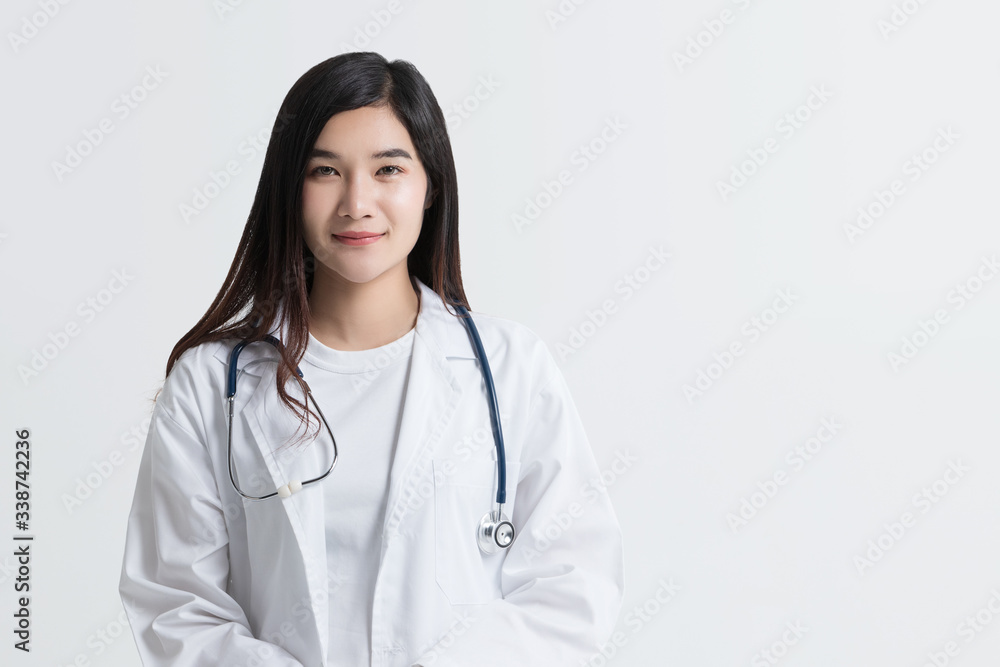 attractive Asian female doctor looking at camera with smiling face, isolated on white background with copy space. studio shot attractive Asian female doctor looking at camera with smiling face, isolated on white background with copy space. studio shot