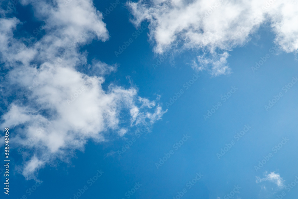 Background nature clear clean blue sky soft clouds beautiful dramatic cloudscape summer sun ray light presents beautiful day life after storm. use as overlay effect or frame with center copy space Background nature clear clean blue sky soft clouds beautiful dramatic cloudscape summer sun ray light presents beautiful day life after storm. use as overlay effect or frame with center copy space