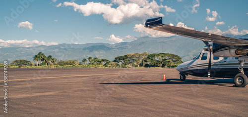 Twin engine propeller plane on the runway of the international airport  of Armenia, Quindio,  Colombia. photo