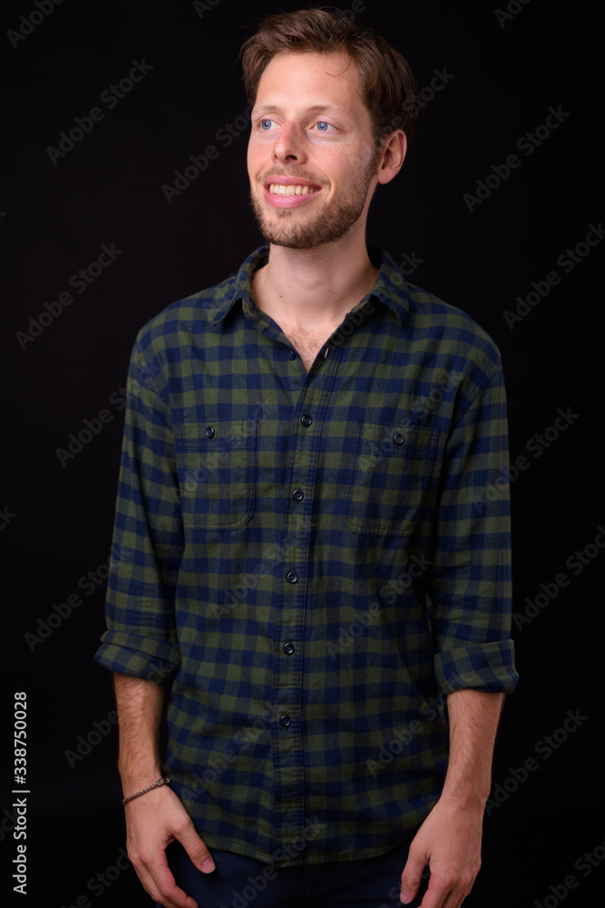 Obraz premium Portrait of happy bearded hipster man thinking