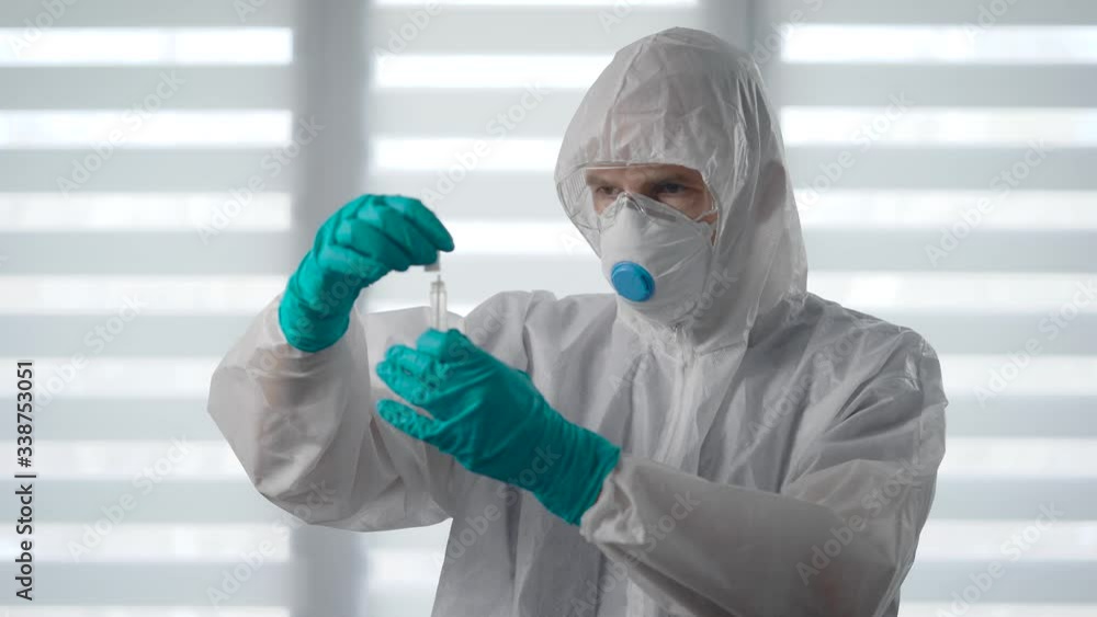 Pandemic Covid-19. The doctor of the infectious disease examines the test test for the virus. Pandemic Covid-19. The doctor of the infectious disease examines the test test for the virus.