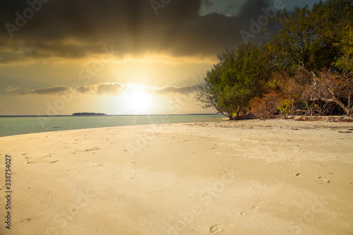 Fototapeta Naklejka Na Ścianę i Meble -  Karimunjawa indonesia java beach coastline rocks. Blue, dream. Sunset.