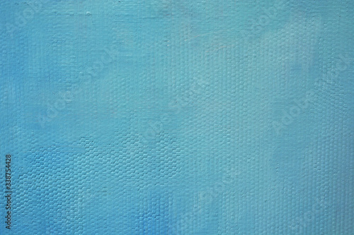 Solid blue background with canvas texture. Blue oil paint on canvas.