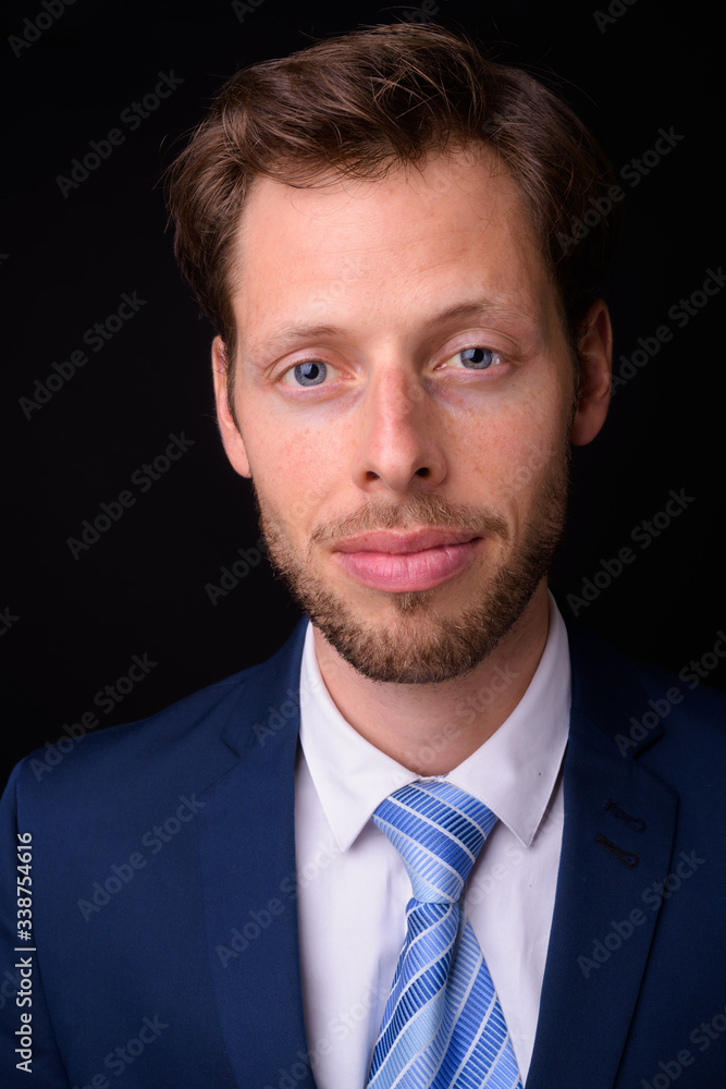Face of handsome bearded businessman in suit Face of handsome bearded businessman in suit