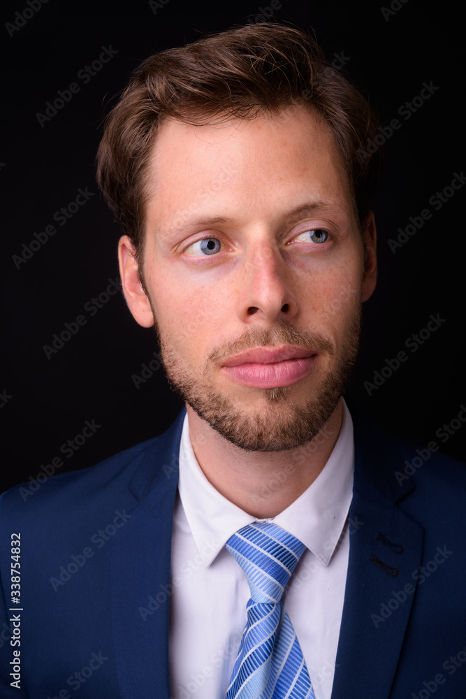 Face of handsome bearded businessman in suit thinking Face of handsome bearded businessman in suit thinking