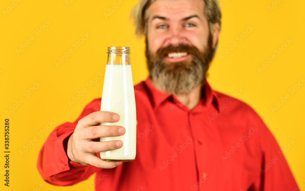 Pasteurized milk. Vegan milk concept. Drink protein cocktail. Shop advertisement. Healthy habits. Prepare plants milk at home. How to be dairy free. Lactose intolerance. Bearded man hold milk bottle Pasteurized milk. Vegan milk concept. Drink protein cocktail. Shop advertisement. Healthy habits. Prepare plants milk at home. How to be dairy free. Lactose intolerance. Bearded man hold milk bottle