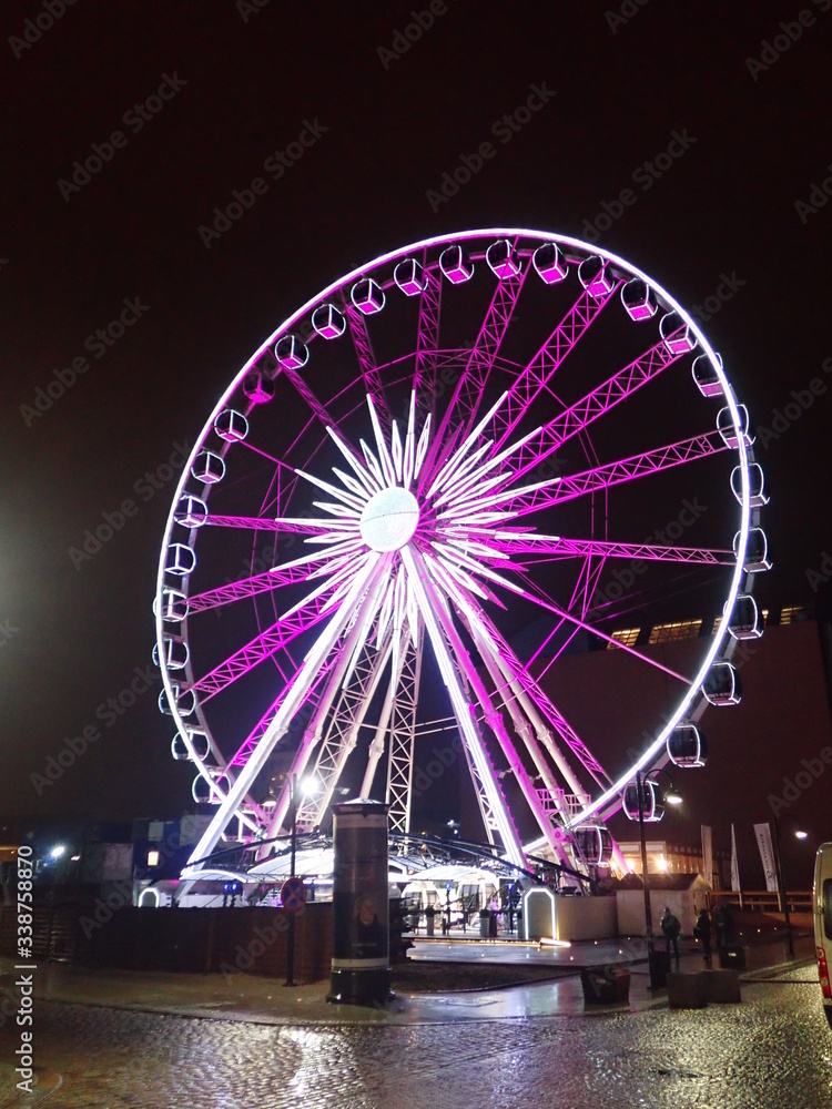 Ferris wheel with numerous colorful backlights in Gdansk - Poland