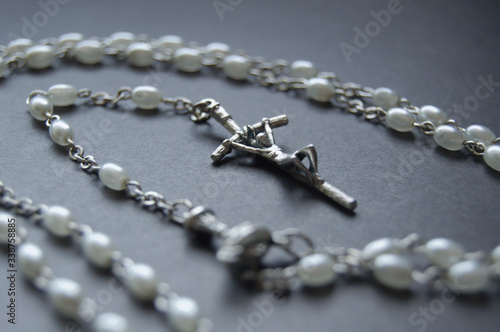 Cross with a rosary ihs black and white. Way of the Cross. Pray to Mary for help in pandemic.