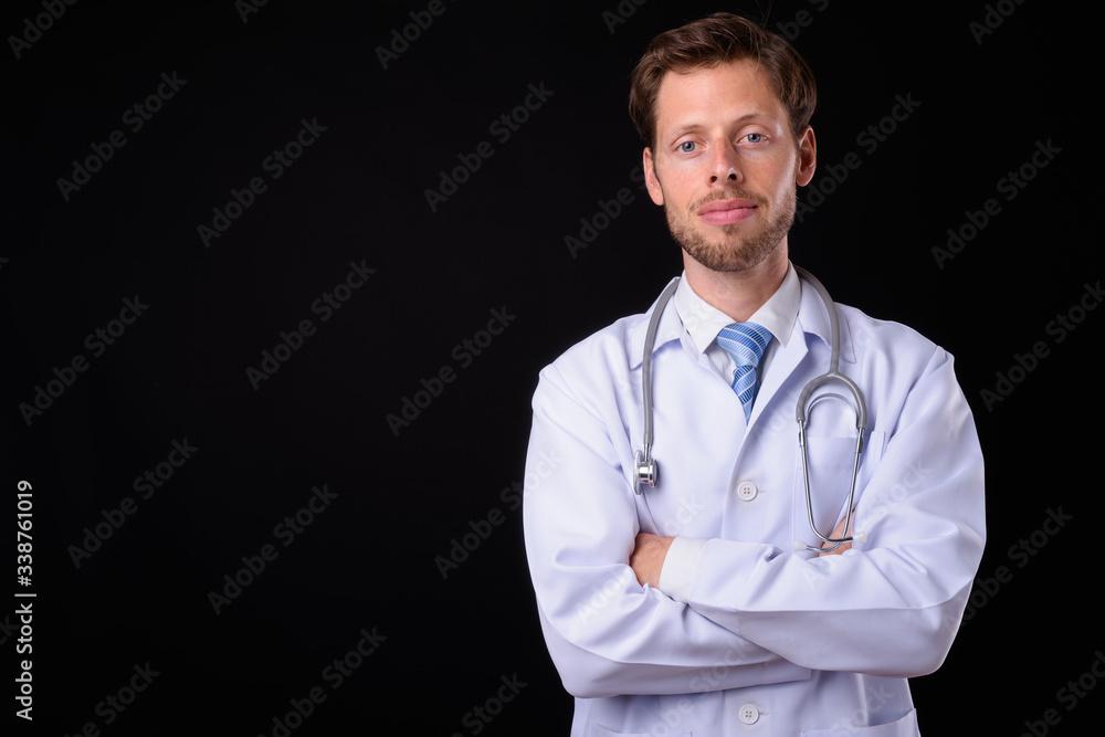 Portrait of bearded man doctor with arms crossed Portrait of bearded man doctor with arms crossed