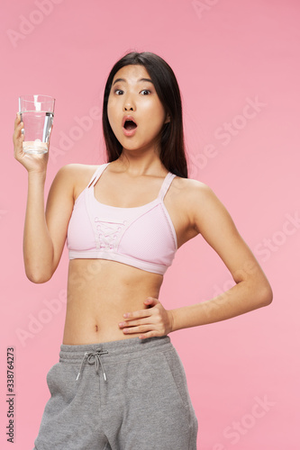 young woman holding bottle of water © SHOTPRIME STUDIO