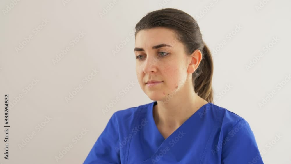 medicine, healthcare and people concept - doctor or nurse in gloves coughing covering mouth with her elbow medicine, healthcare and people concept - doctor or nurse in gloves coughing covering mouth with her elbow