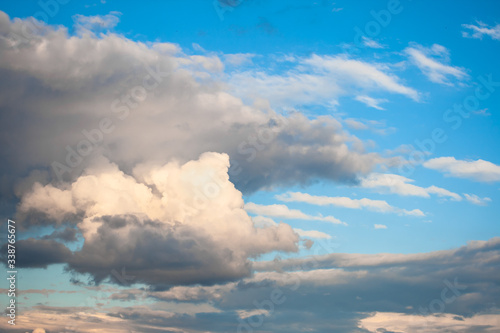 Sky view, with large cumulus clouds forming rows and a nice blue sky in the background