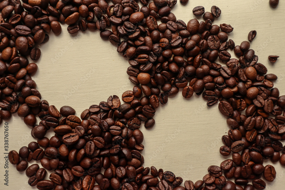 Coffee grains with space for text on brown paper background Coffee grains with space for text on brown paper background