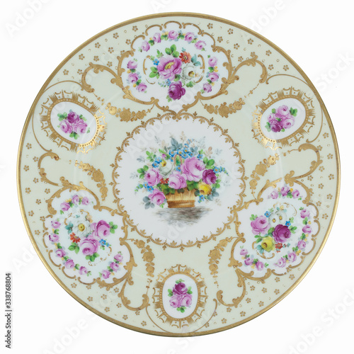 antique gold plate with flowers isolated on white background