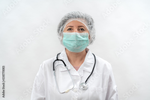 Tired doctor nurse after work in laboratory clinic with mask stethoscope.