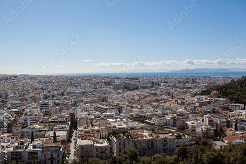 skyline of the city of Athens from the top of a hill with the sea in the background © Rg. Martinez