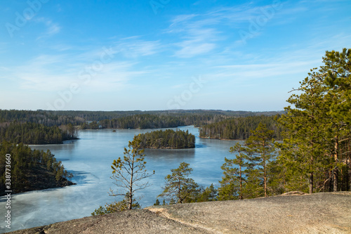 Beautiful landscape with icy lake in the national park Repovesi, Finland